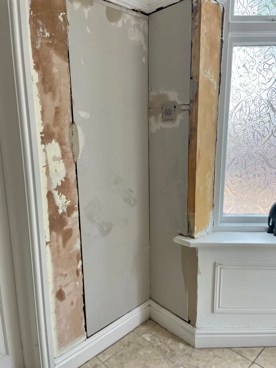 Membrane board fixed across the treated brickwork.
