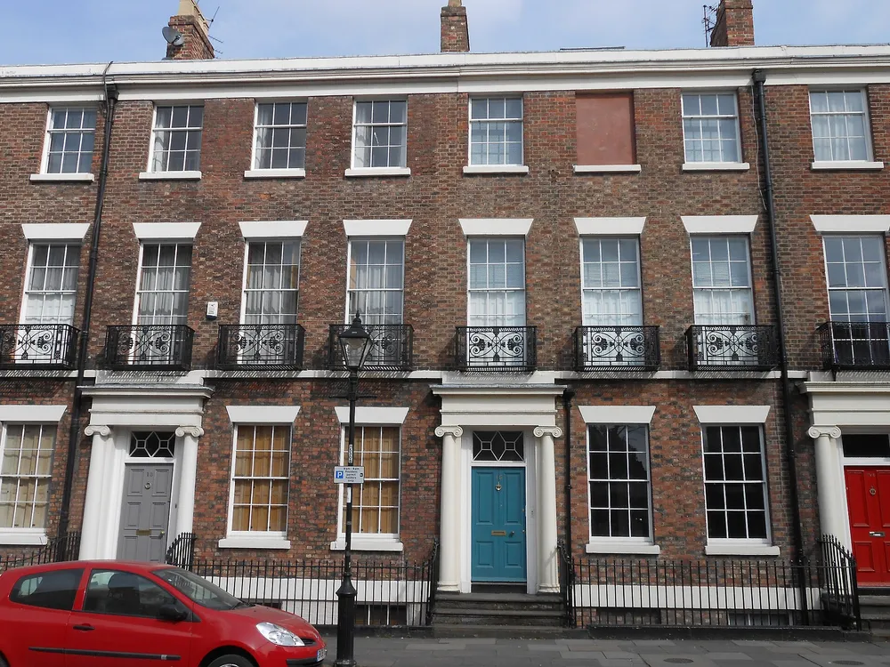 Georgian houses on Canning Street, with basement windows behind the railings